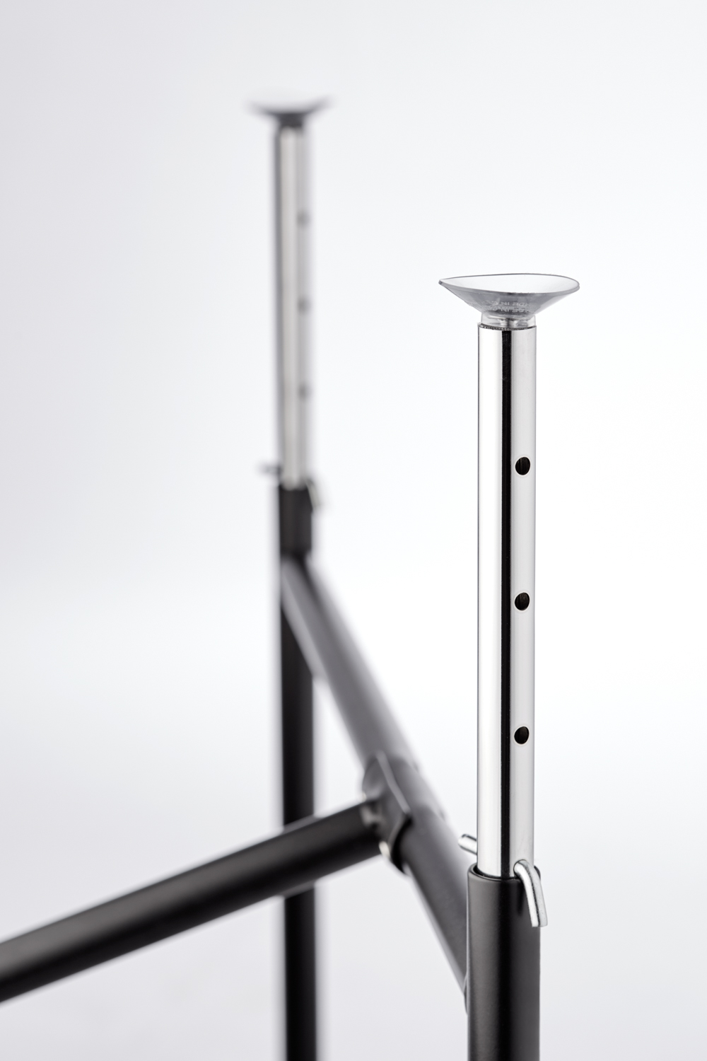 Long height adjuster, chrome, suction cups on top, supplement to office desk E2